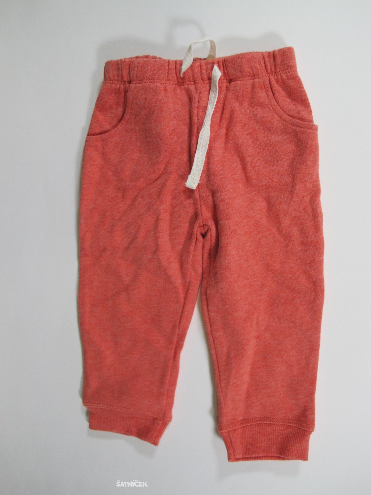 Oranžovo červené tepláky  secondhand